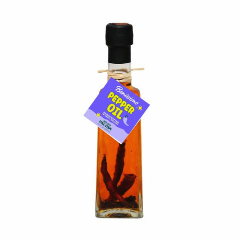 Bottle of pepper oil with a label on a white background