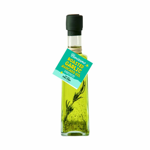 Bottle of roasted garlic avocado oil with a label on a white background