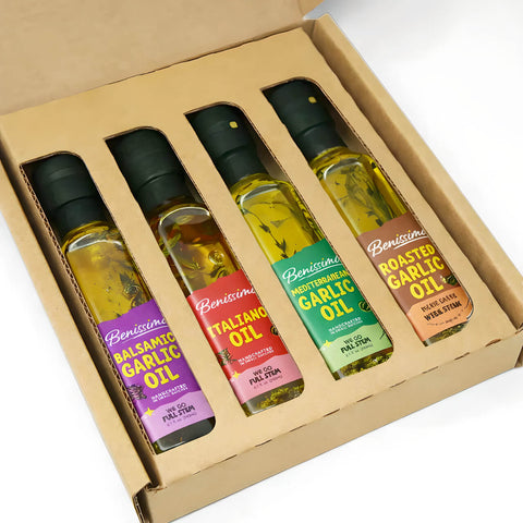 Set of four Benissimo oil bottles in a box on a white background