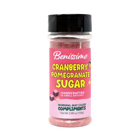 Bottle of cranberry pomegranate sugar with pink label on white background