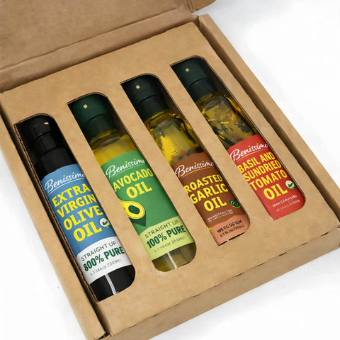 Set of Benissimo oil bottles in a cardboard box on a white background