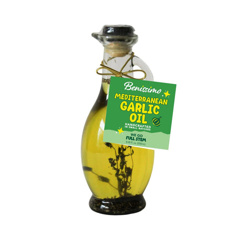 Bottle of Benissimo Mediterranean Garlic Oil with a green label on a white background