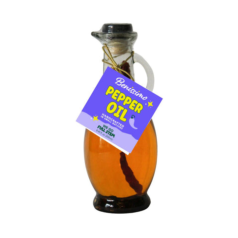 Bottle of pepper oil with a purple label on a white background