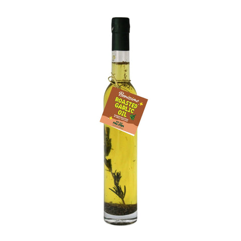 Bottle of roasted garlic oil with a label on a white background